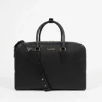 Voyage travel bag in black grained leather, front view