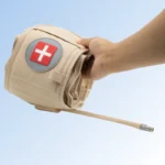 hand holding rolled up compact inflatable decompression belt